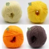 Nuancier de fil coton bio Alba de BC Garn avec les coloris écru, jaune vif, orange et brun taupe.