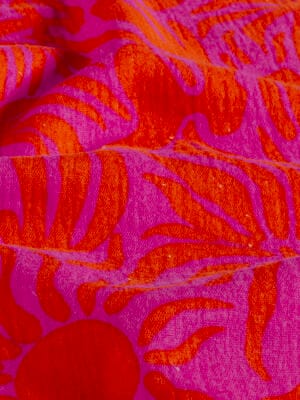 zoom et détail de la double gaze de coton motif soleil rose