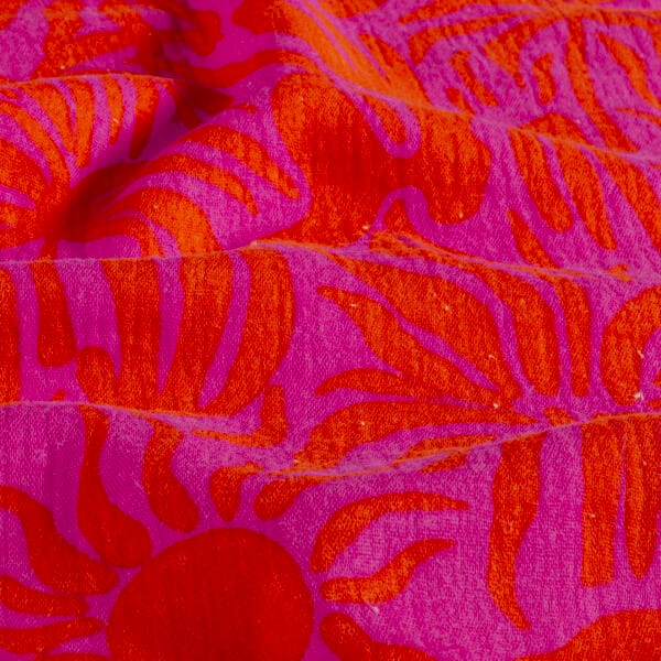 zoom et détail de la double gaze de coton motif soleil rose