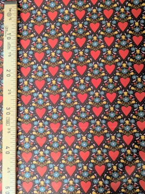 Tissu coton Danyl à grands cœurs orange-rouge, petites fleurs bleu turquoise et feuillages moutarde sur fond chocolat, imprimé rétro années 70.